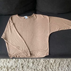 T-Wing tan sweater.
